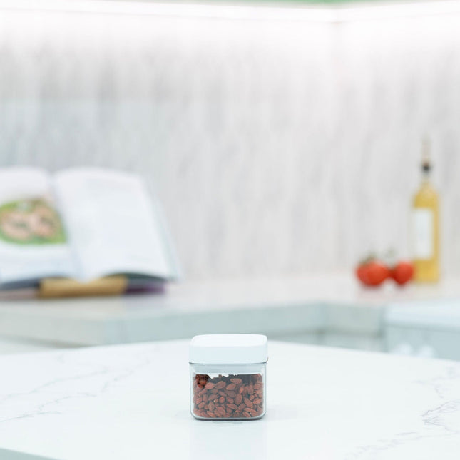 Elegant White Airtight Container – 600ML on kitchen countertop, perfect for pantry organisation and storing dry goods.