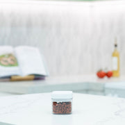 Elegant White Airtight Container – 600ML on kitchen countertop, perfect for pantry organisation and storing dry goods.
