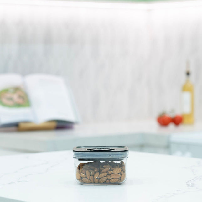 Black Airtight Container with Twist Lock – 500ml on kitchen bench storing almonds, ideal for pantry and kitchen organisation.