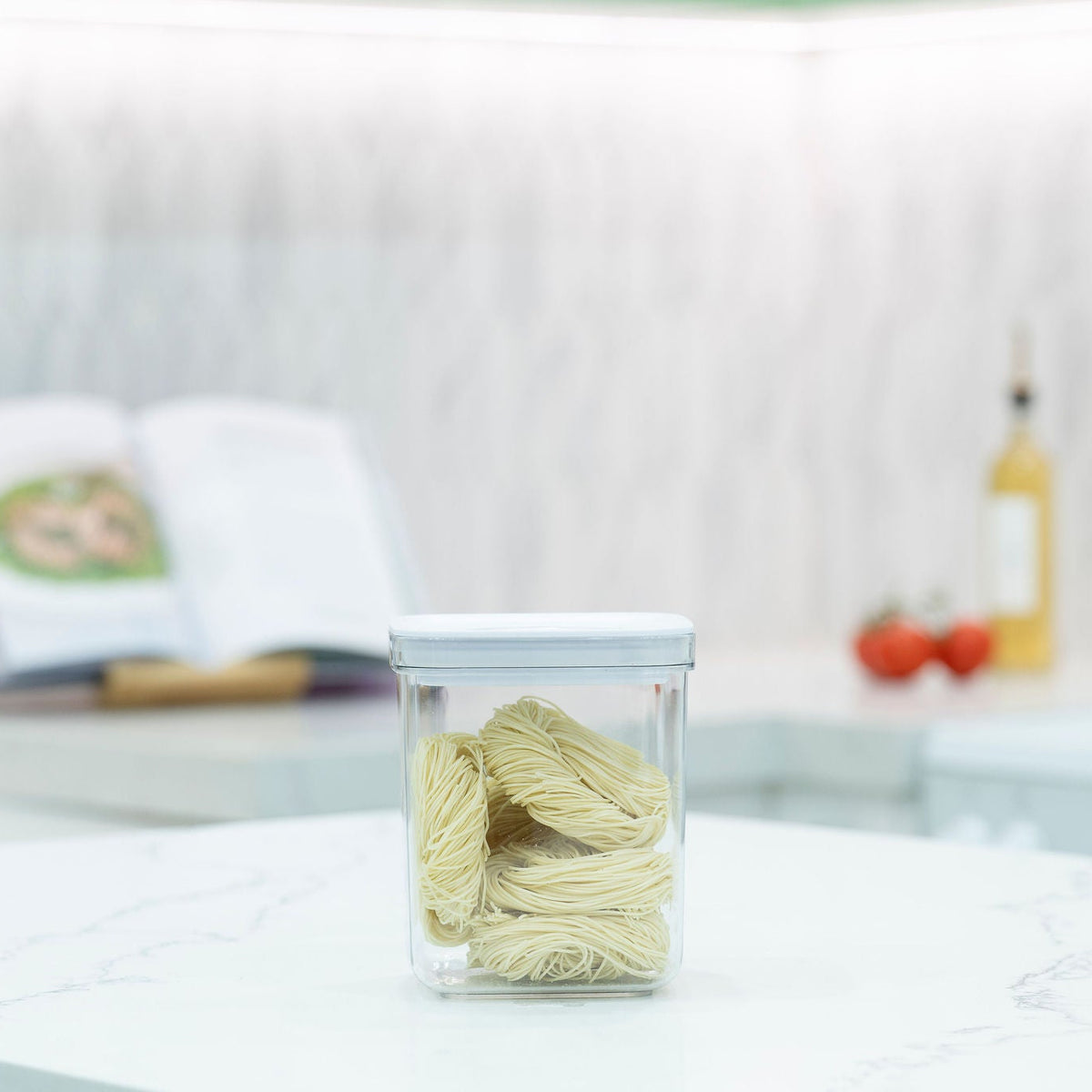 White Airtight Container with Twist Lock – 1300ml holding pasta, ideal for kitchen organisation and storage organisers on a benchtop.
