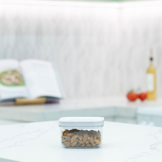 White Airtight Container with Twist Lock – 500ml for kitchen storage keeping almonds fresh on a countertop.