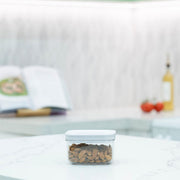 White Airtight Container with Twist Lock – 500ml for kitchen storage keeping almonds fresh on a countertop.