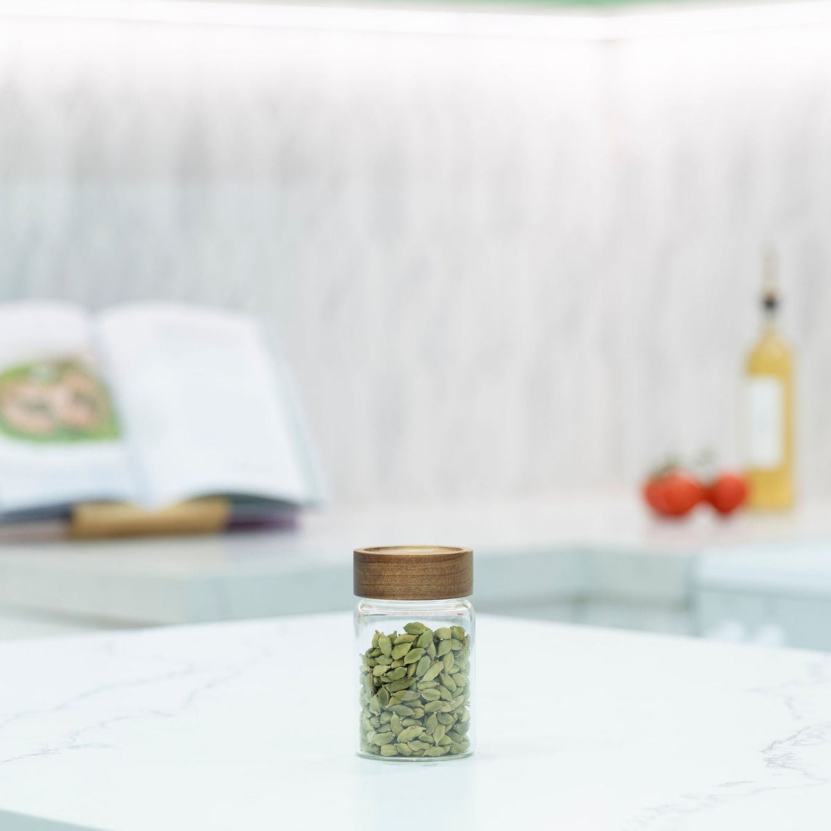 Acacia Screw On Spice Glass Jar - 250ml filled with dried herbs on a kitchen benchtop
