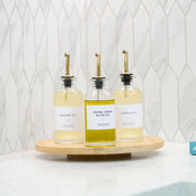 Round Glass Oil & Vinegar Bottle – 350ml Dispenser on a kitchen countertop for pantry organisation and kitchen storage.