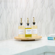 Bamboo Rotating Storage Turntable – Lazy Susan holding oil jars on a kitchen counter for efficient pantry organisation.