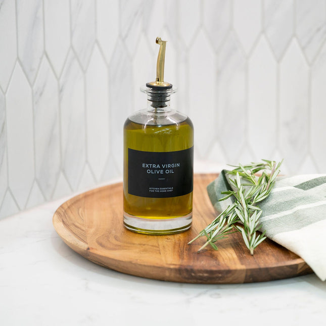Round Glass Oil & Vinegar Bottle – 350ml Dispenser on wooden tray for kitchen and pantry organisation.