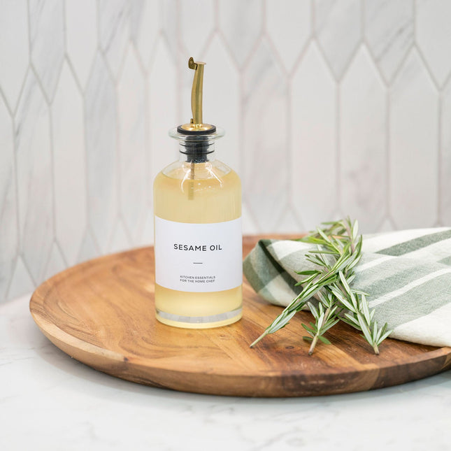 Round Glass Oil & Vinegar Bottle – 350ml Dispenser on a kitchen countertop for efficient pantry organisation.
