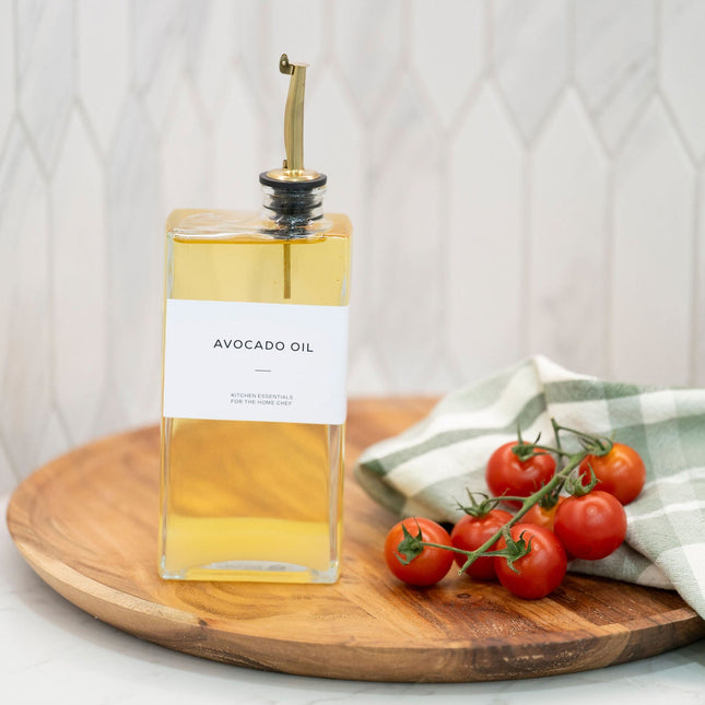 Glass Oil & Vinegar Dispenser Set – 2 Pack (500ml, Book Style) displayed in a kitchen setting with fresh tomatoes.
