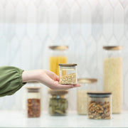 Square Acacia Spice Jars – 3 Sizes displayed on a kitchen countertop, ideal for adding elegance to pantry organisation.