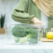Clear Fridge Organiser with Lid used for storing broccoli in a kitchen, ideal for fridge organisation and preserving fresh produce.