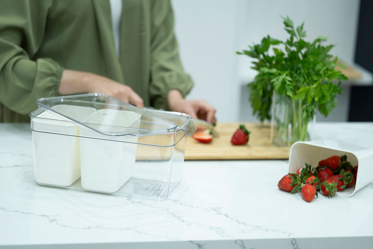 Triple Clear Fridge Organiser with Removable Baskets on kitchen counter for efficient fridge storage and kitchen organisation.