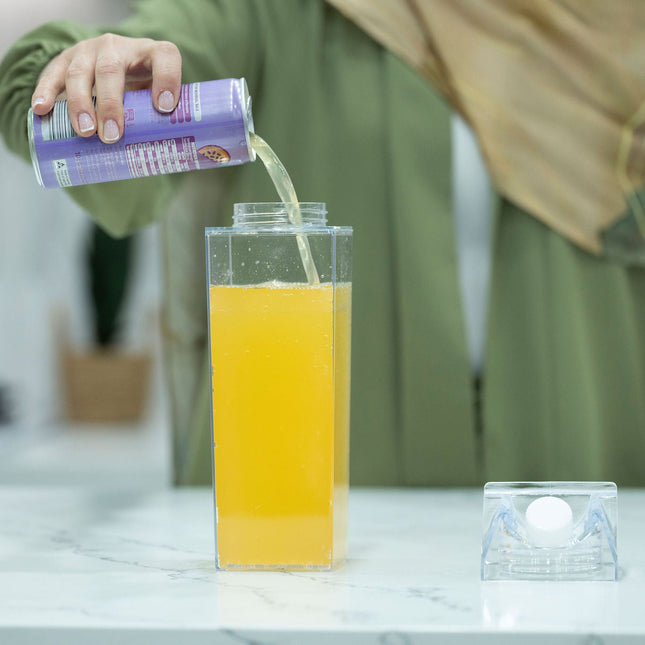 Clear Drink Container – 2 Liter with orange soda pour, ideal for fridge storage in Australian kitchens