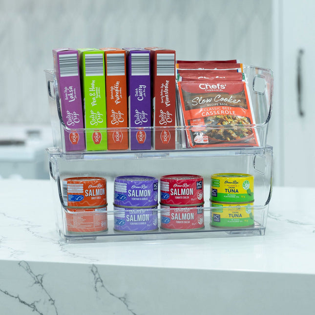 Large Clear Stackable Organiser storing pantry items like soup boxes and canned fish for efficient kitchen organisation.