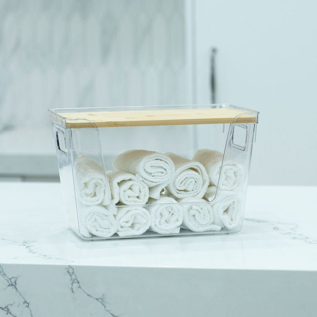Clear Storage Container with Bamboo Lid – 29cm used for bathroom towel organisation, enhancing under sink storage efficiency.