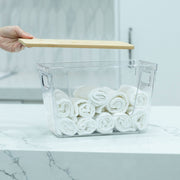 Clear Storage Container with Bamboo Lid – 29cm holding rolled-up towels, ideal for bathroom or pantry organisation.