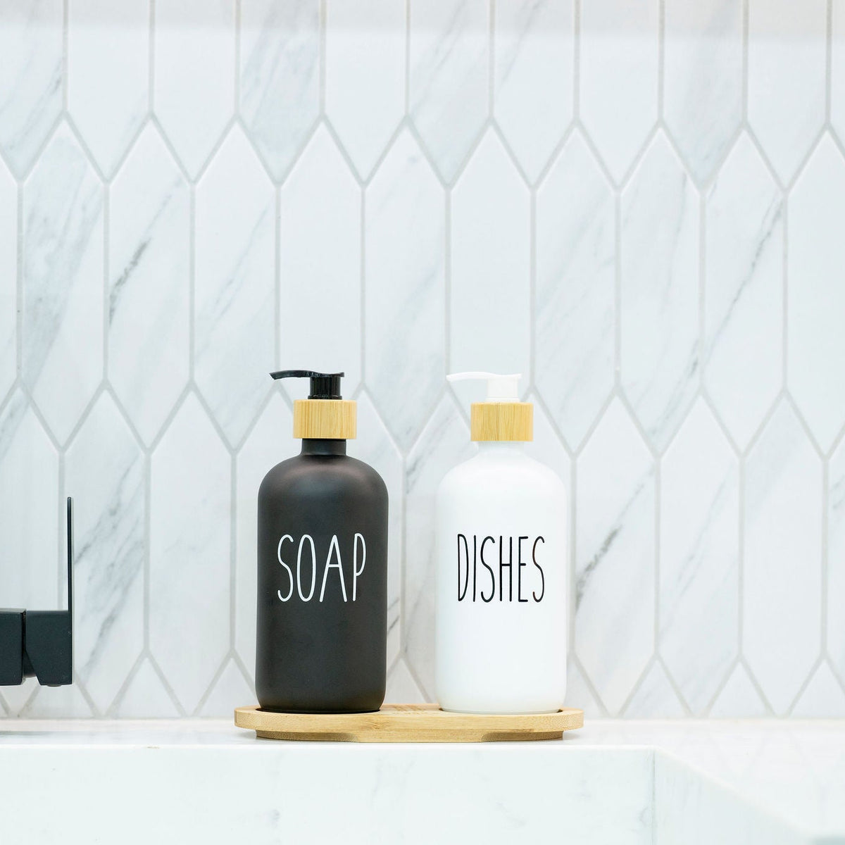White Glass Pump Bottle – 500 ml Refillable Dispenser on kitchen counter with bamboo accents