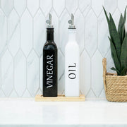 Black Oil and Vinegar Bottle – 500ml Modern Glass Dispenser for kitchen organisation on a marble countertop.