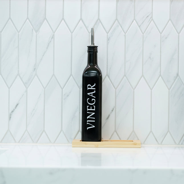 Black Oil and Vinegar Bottle – 500ml Modern Glass Dispenser on a kitchen benchtop for efficient pantry organisation.