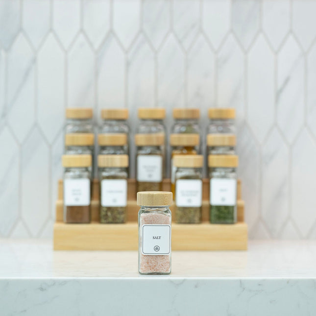 Bamboo Shaker Spice Jar – 120 ml on a kitchen counter, ideal for pantry organisation with glass jars for efficient spice storage.