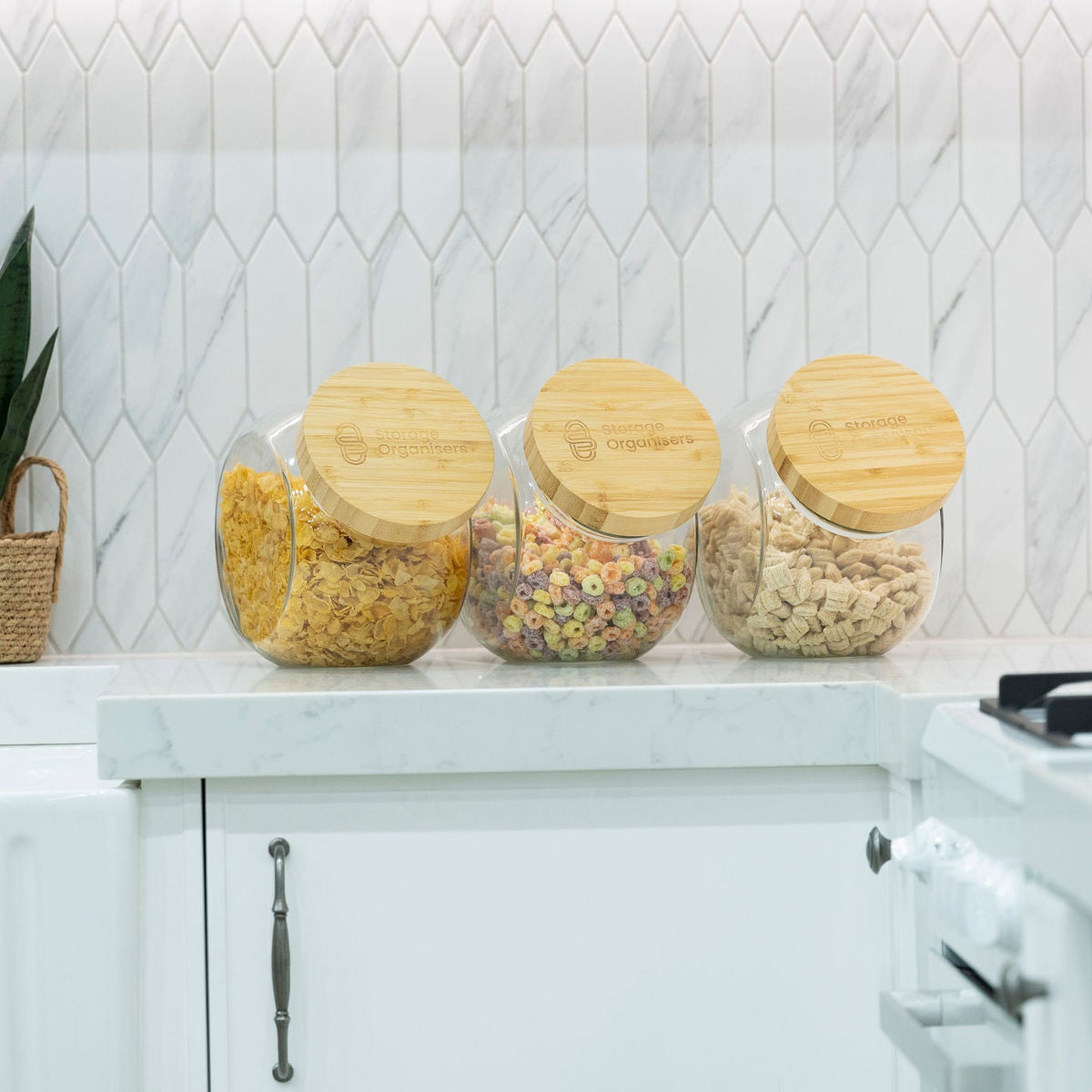New Home Set Up Pack glass jars with bamboo lids for pantry storage on a kitchen bench