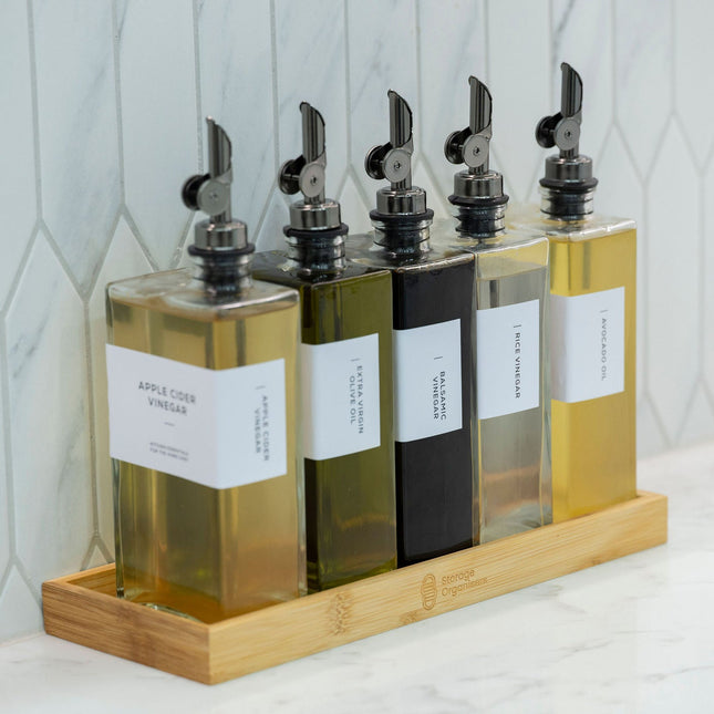 Bamboo Rectangle Tray neatly organising glass jars of oils and vinegars, perfect for enhancing kitchen and pantry storage organisation.