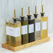 Oil & Vinegar Book Bottles with Bamboo Tray – 5 Pack for kitchen organisation on marble counter.