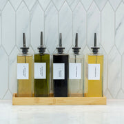 Glass Oil & Vinegar Book Bottle – 350ml Dispenser in bamboo tray, perfect for pantry storage and kitchen organisers.
