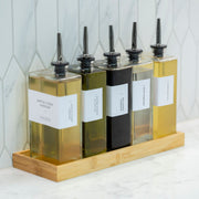 Oil & Vinegar Book Bottles with Bamboo Tray – 5 Pack for kitchen organisation on a counter, perfect as storage organisers.