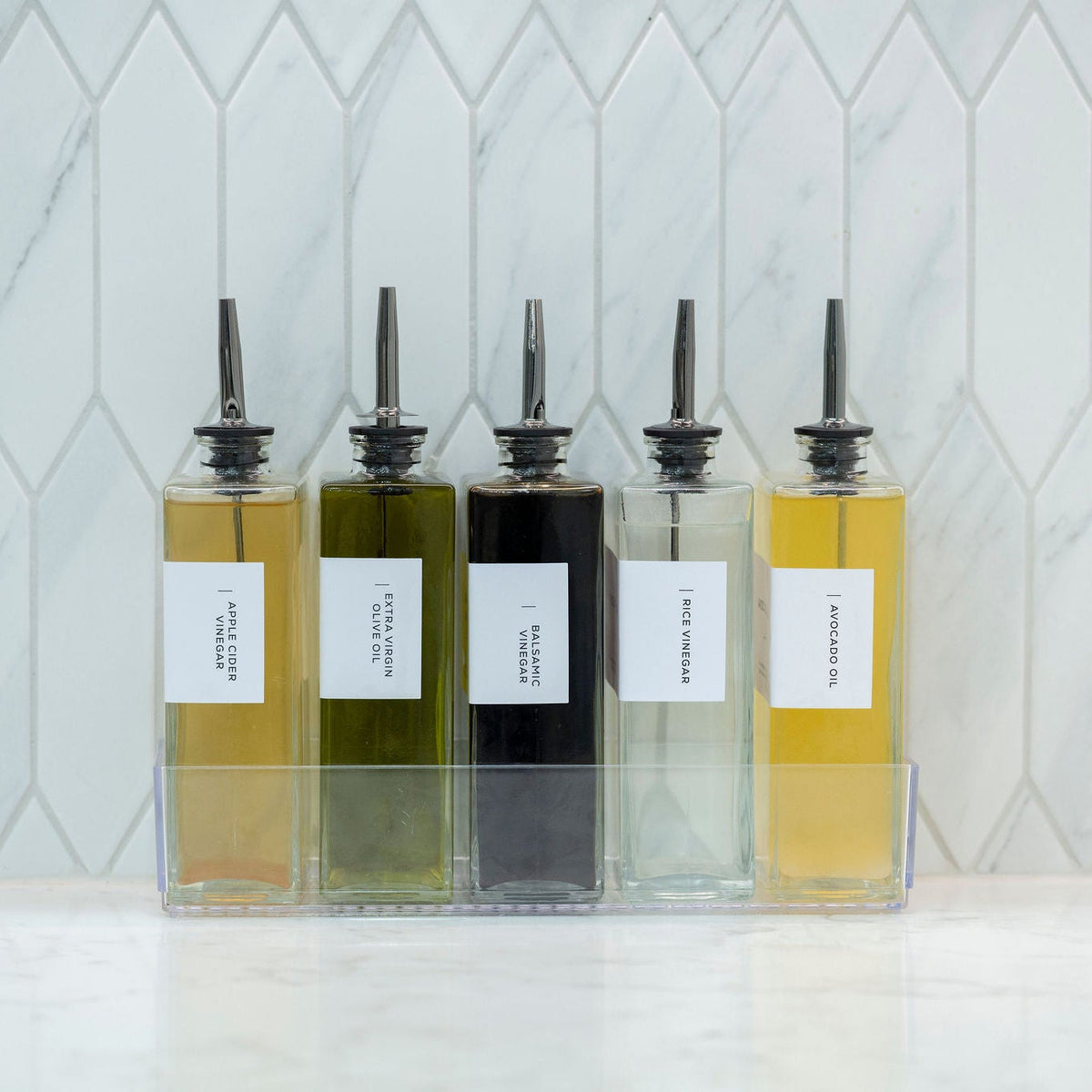 Glass Oil & Vinegar Bottles with Tray – 5 Pack on kitchen counter for pantry organisation and efficient kitchen storage.