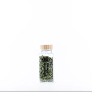 Bamboo Shaker Spice Jar – 250 ml filled with dried herbs, perfect for kitchen and pantry organisation; an elegant glass jar for spices.