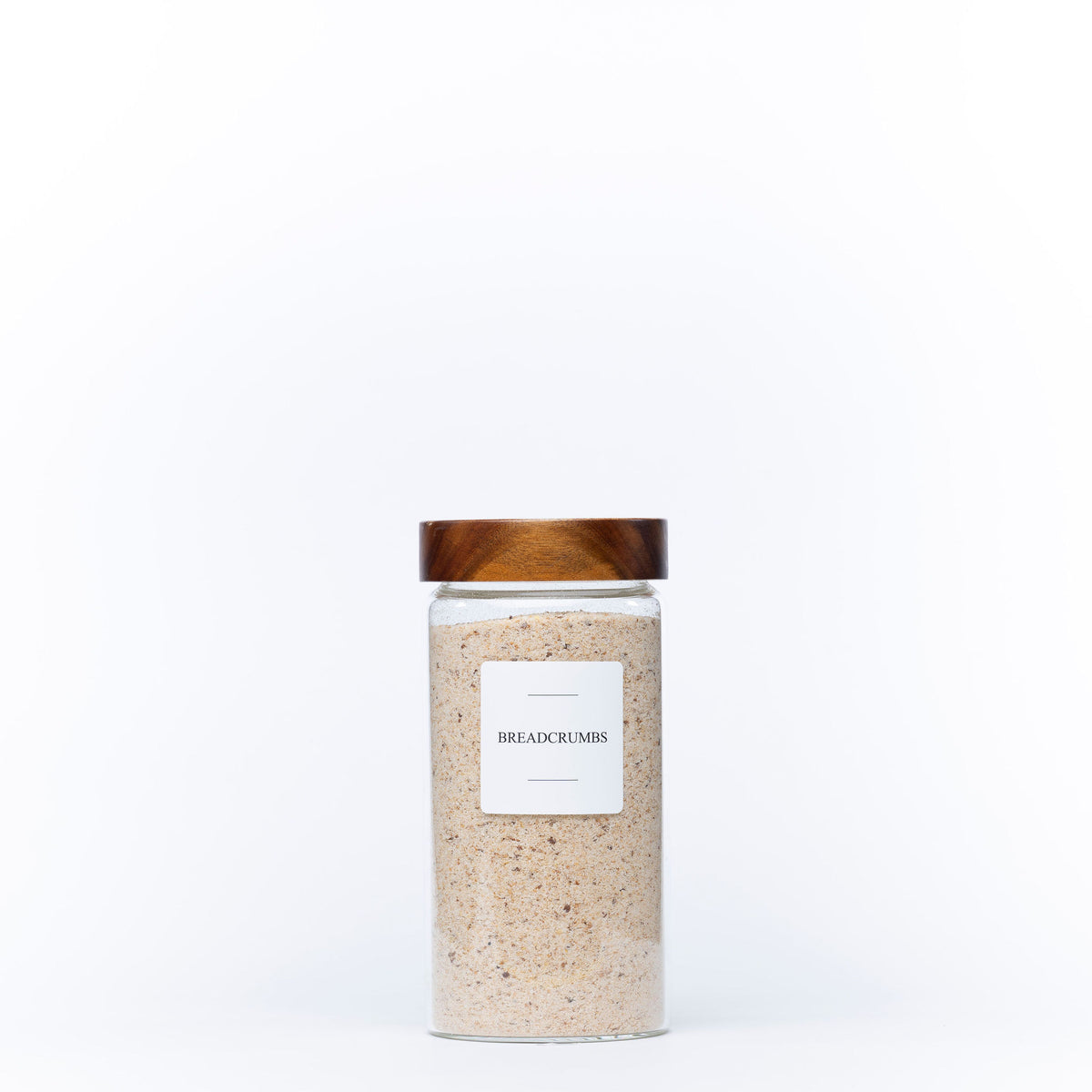 1200ml Acacia Screw-On Glass Pantry Jar filled with breadcrumbs for efficient kitchen and pantry organisation.