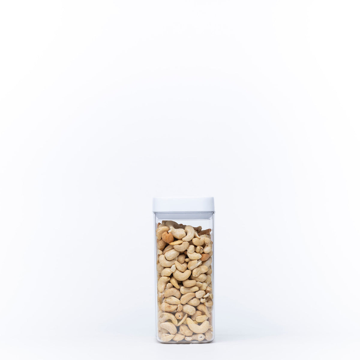 Elegant White Airtight Container – 1100ML filled with cashews, perfect for pantry organisation and keeping snacks fresh.