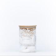 Stackable Round Bamboo Glass Jar – 450ml filled with cotton pads and swabs for bathroom storage and organisation.