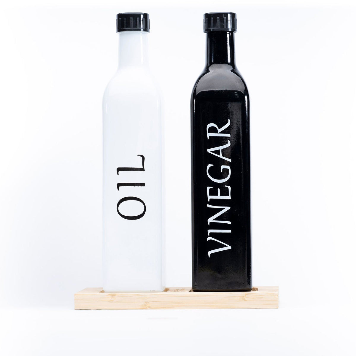 Black Oil and Vinegar Bottle – 500ml Modern Glass Dispenser on kitchen counter for efficient pantry organisation.