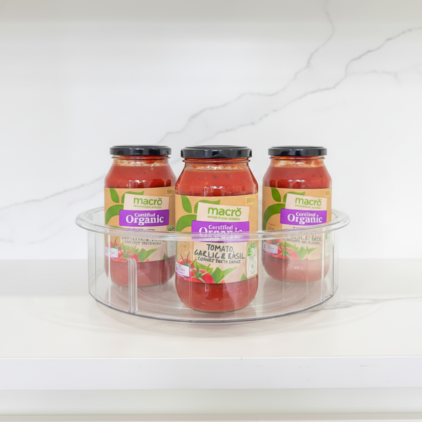 Tall Round Clear Rotating Tray - Lazy Susan holding jars, ideal for kitchen organisation and pantry storage.