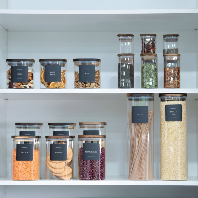 Acacia Square Pantry Collection of glass jars for pantry organisation, ideal for storing nuts, pasta, and lentils in a kitchen setting.