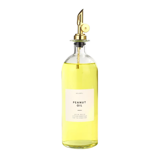 Glass peanut oil dispenser with gold spout, ideal for stylish kitchen storage and home organization, 500ml.