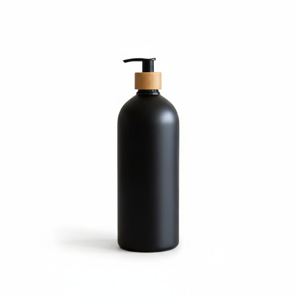 Black soap dispenser with wooden pump on a kitchen counter