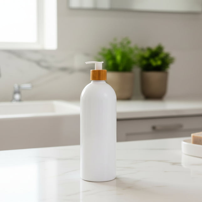White Bathroom Pump Bottle – 1 L Refillable Dispenser on a kitchen counter for efficient storage and organisation.