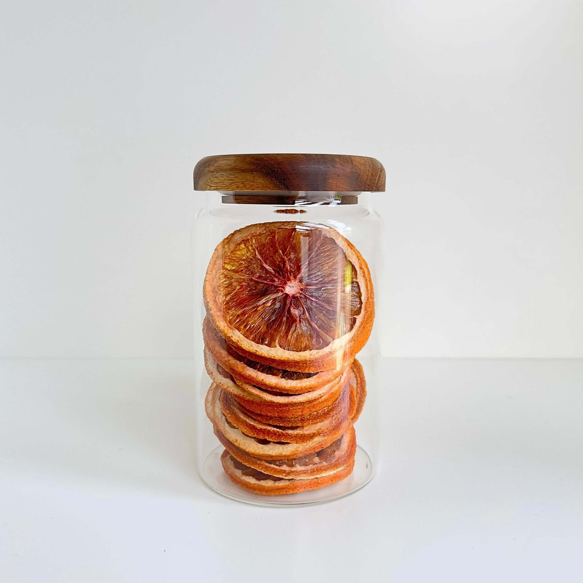 Acacia Lid Glass Jar Small Pantry Organisation 15 Pack shown with dried citrus, ideal for kitchen and pantry glass jar organisers.