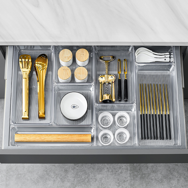 Clear Drawer Organisers – 5 Modular Sizes Available neatly storing kitchen utensils and spices, enhancing kitchen organisation.