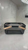 Black metal kitchen basket with wooden handles, ideal for pantry or under sink storage.