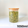 1050ml round glass storage jar with bamboo lid, ideal for pantry organization.
